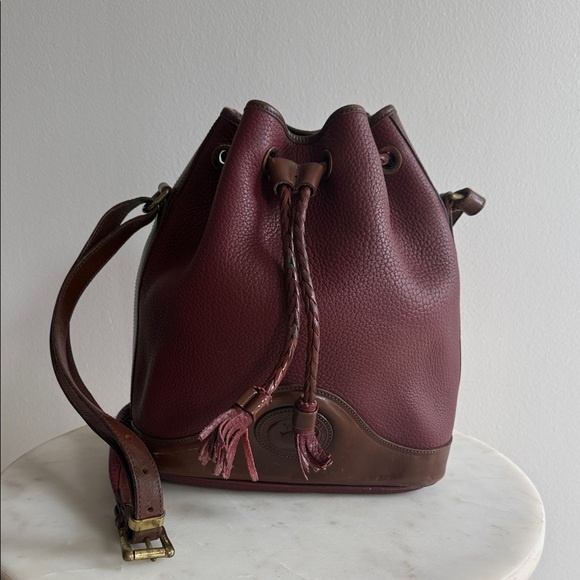 Dooney & Bourke Handbags - Dooney & Bourke Elegant Burgundy Leather Bucket Bag